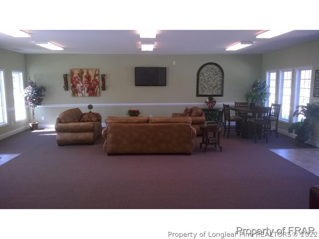 45 Crane (113) Way Bunnlevel, NC 28323 - Photo 8 of 18 a living room with furniture a rug and a window