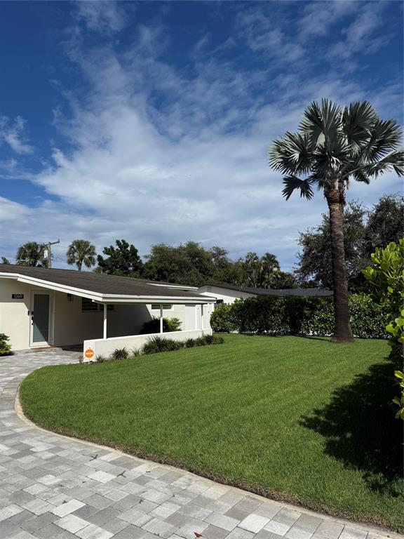 1269 Northwest 4th Street Boca Raton, FL 33486 - Photo 1 of 35 a view of a house with a yard