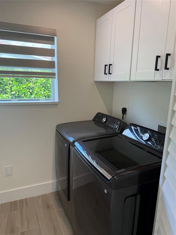 1269 Northwest 4th Street Boca Raton, FL 33486 - Photo 14 of 35 a kitchen with a stove and a microwave