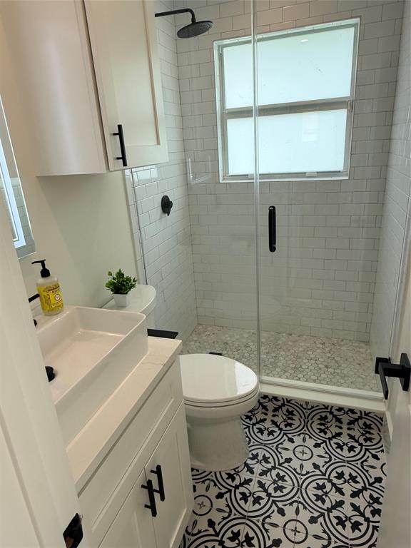 1269 Northwest 4th Street Boca Raton, FL 33486 - Photo 20 of 35 a bathroom with a sink toilet and shower