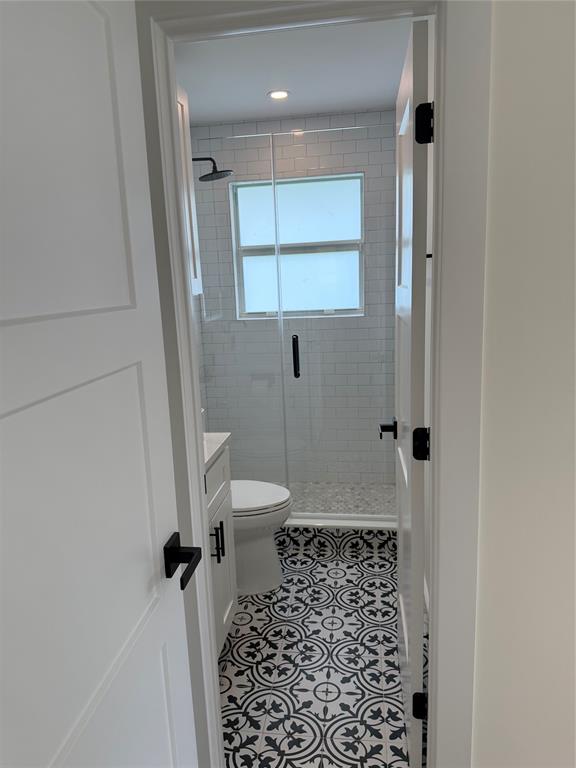 1269 Northwest 4th Street Boca Raton, FL 33486 - Photo 21 of 35 a bathroom with a toilet and a shower