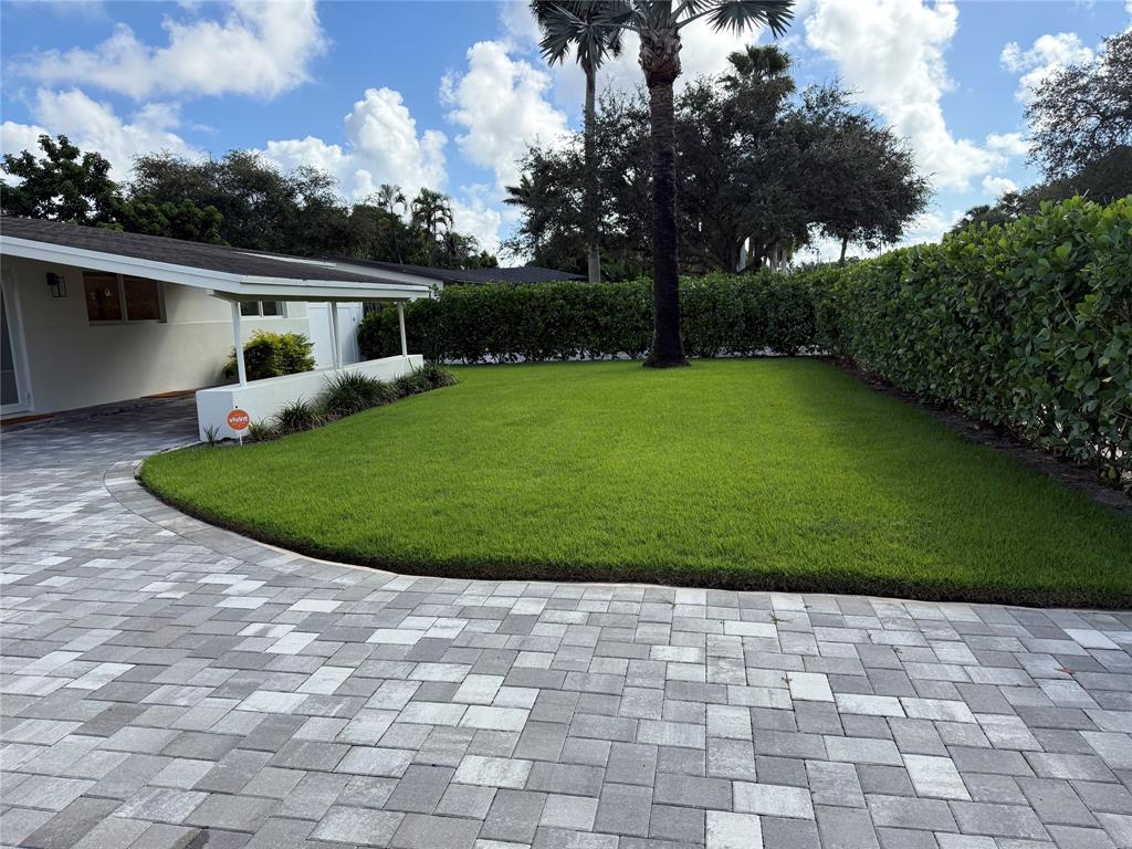1269 Northwest 4th Street Boca Raton, FL 33486 - Photo 35 of 35 a view of a white house with a sink and backyard