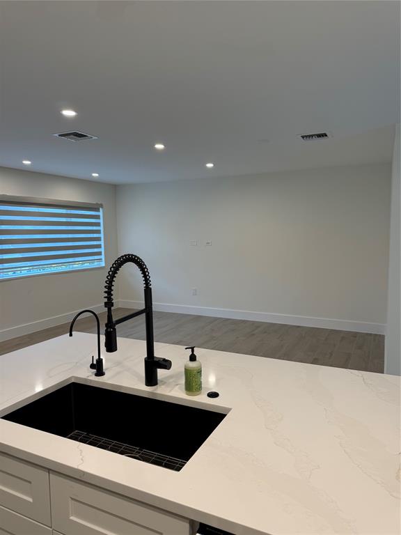 1269 Northwest 4th Street Boca Raton, FL 33486 - Photo 10 of 35 a kitchen with a sink and cabinets