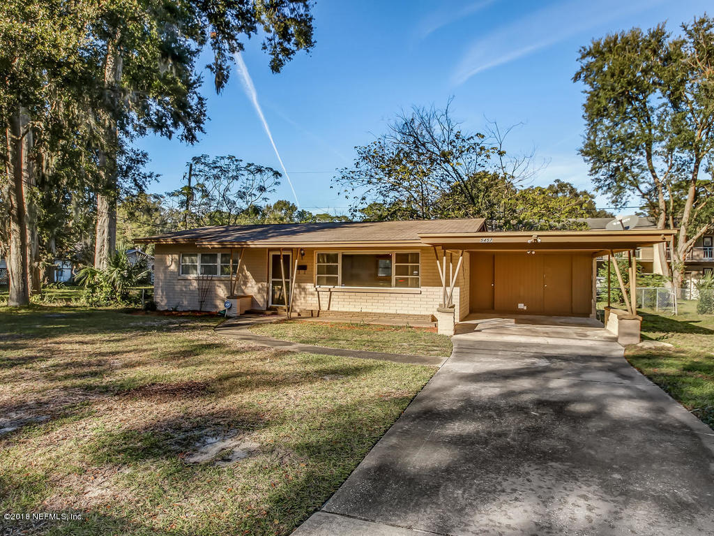 5457 Burdette Road Jacksonville, FL 32211 - Photo 4 of 31 a front view of a house with a garden