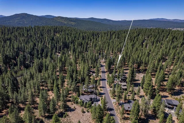 a view of a lush green hillside and a building