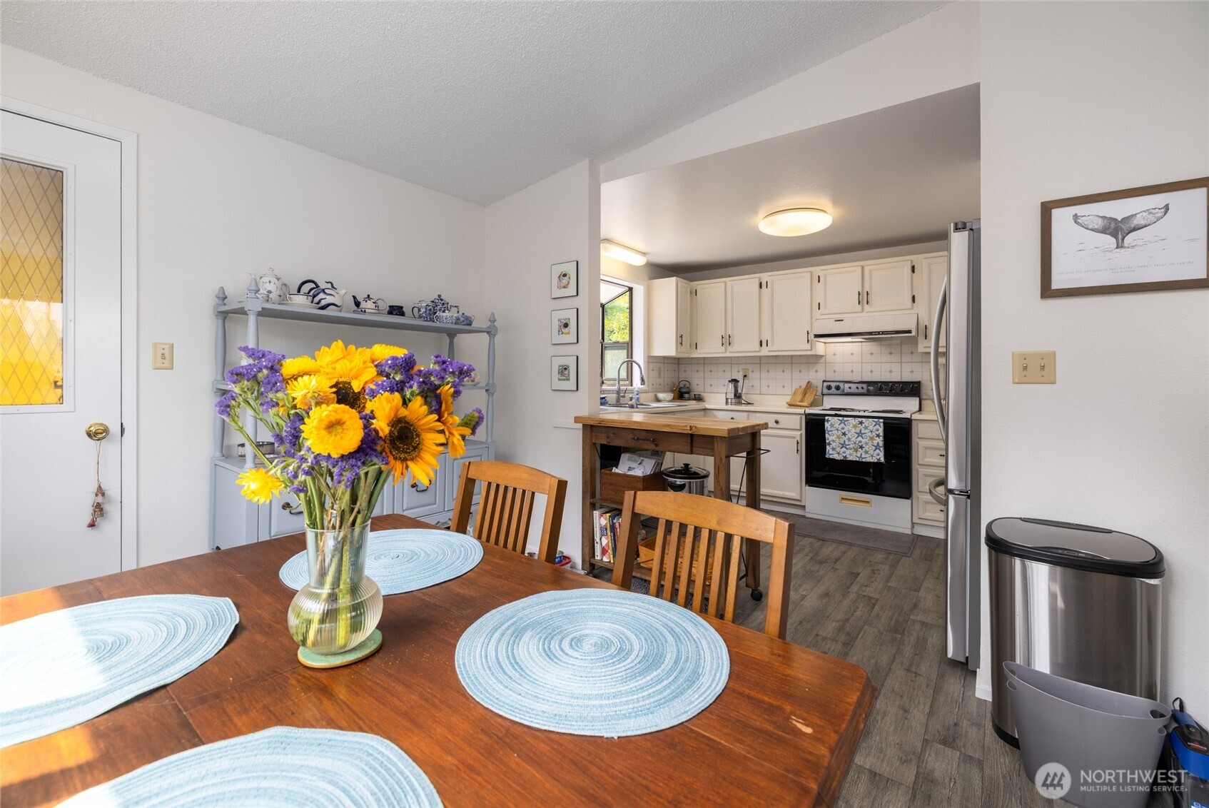 494 Colville Way La Conner, WA 98257 - Photo 11 of 39 a dining room with furniture and wooden floor