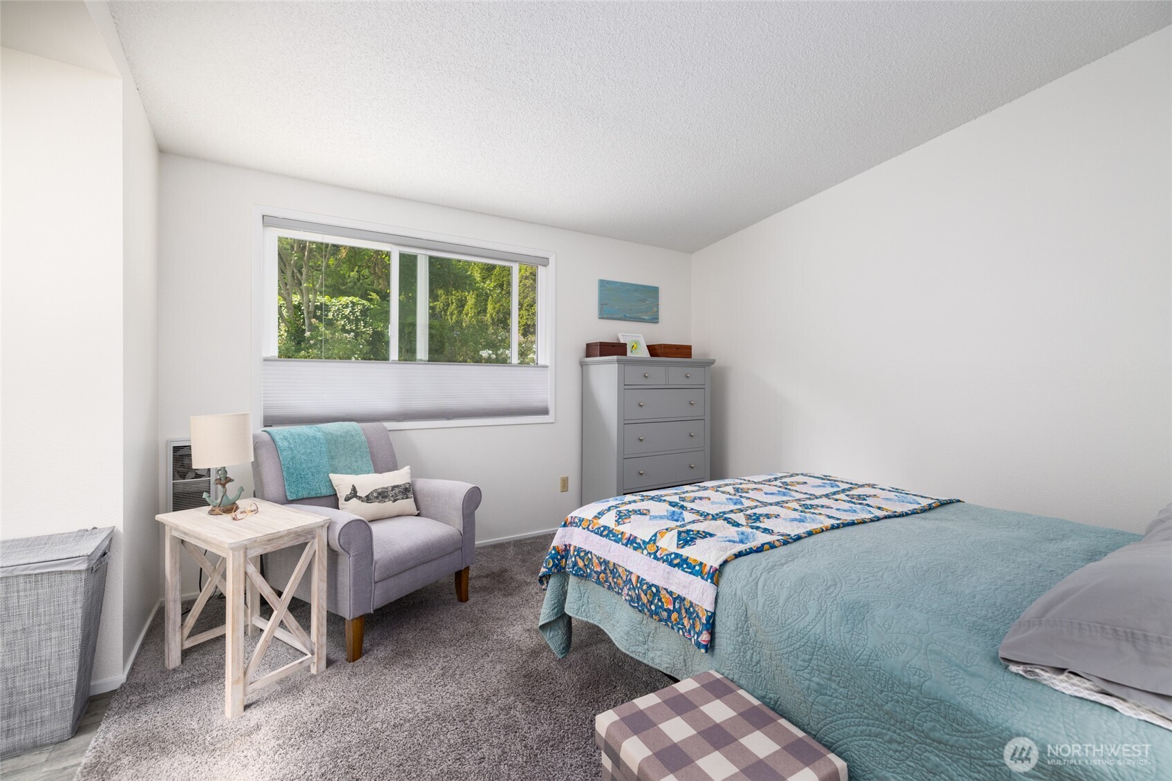 494 Colville Way La Conner, WA 98257 - Photo 20 of 39 a bedroom with a bed and a window