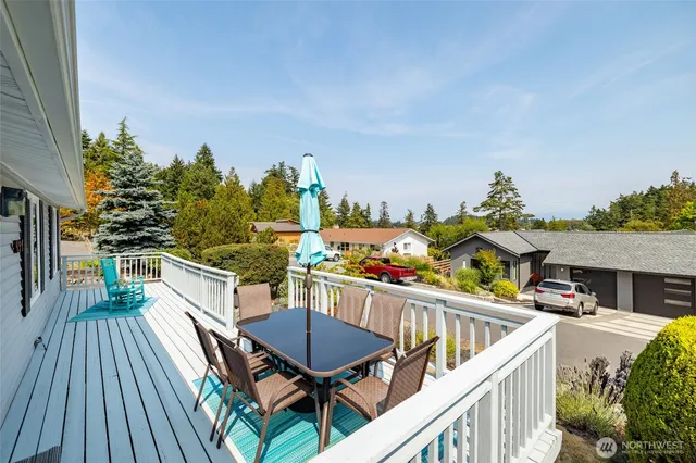 a view of a balcony and chairs
