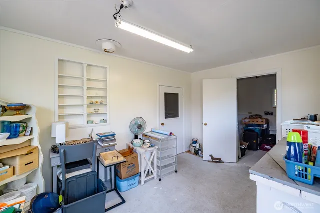 a bedroom with furniture and a wooden floor