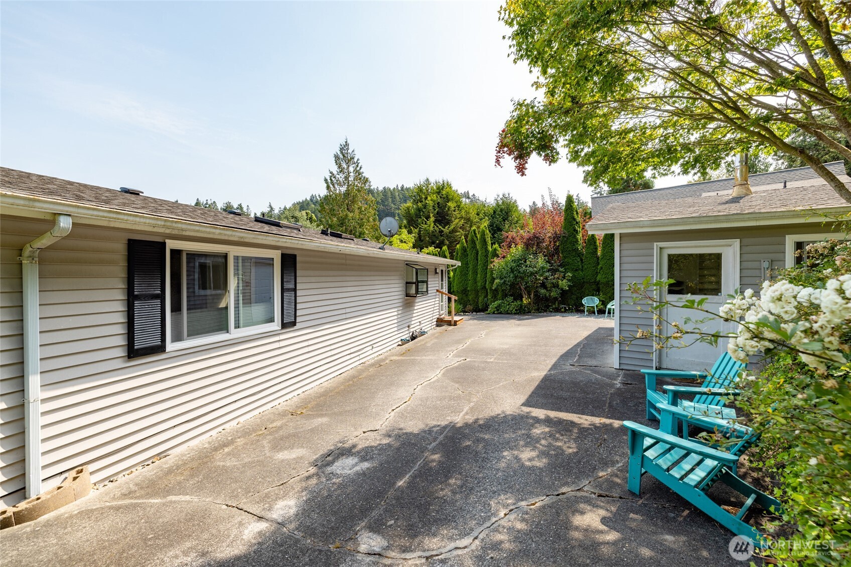 494 Colville Way La Conner, WA 98257 - Photo 34 of 39 a view of a house with a yard and a large tree
