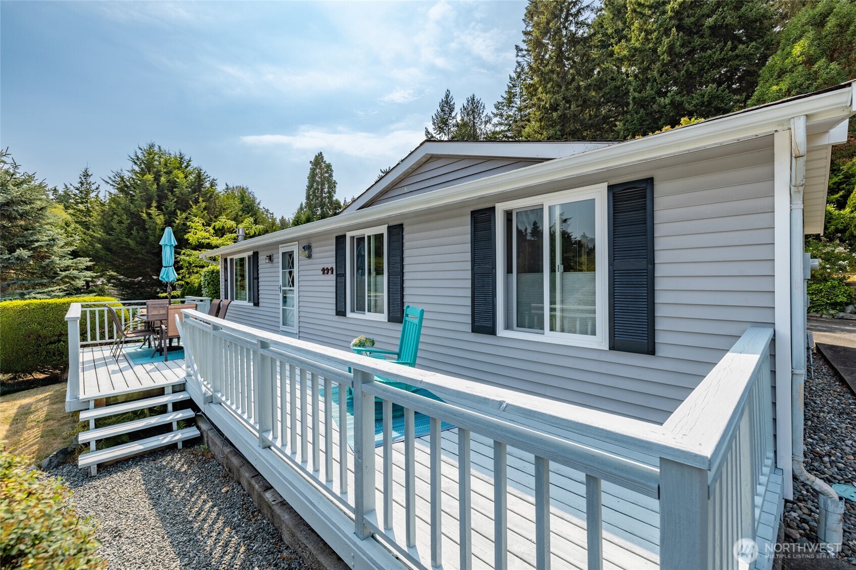 494 Colville Way La Conner, WA 98257 - Photo 35 of 39 a view of a house with wooden deck and furniture