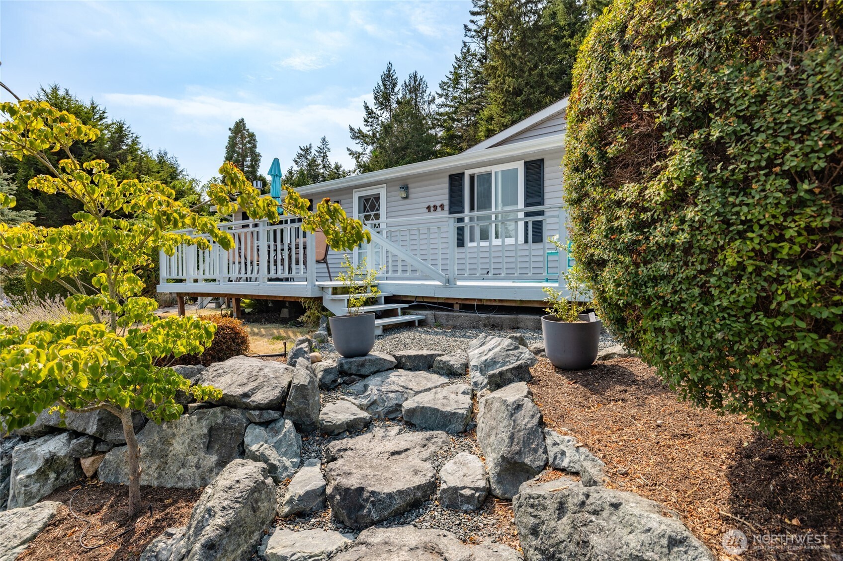 494 Colville Way La Conner, WA 98257 - Photo 36 of 39 a view of a house with wooden chairs and floor