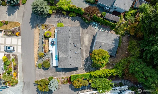 an aerial view of residential house with outdoor space and swimming pool