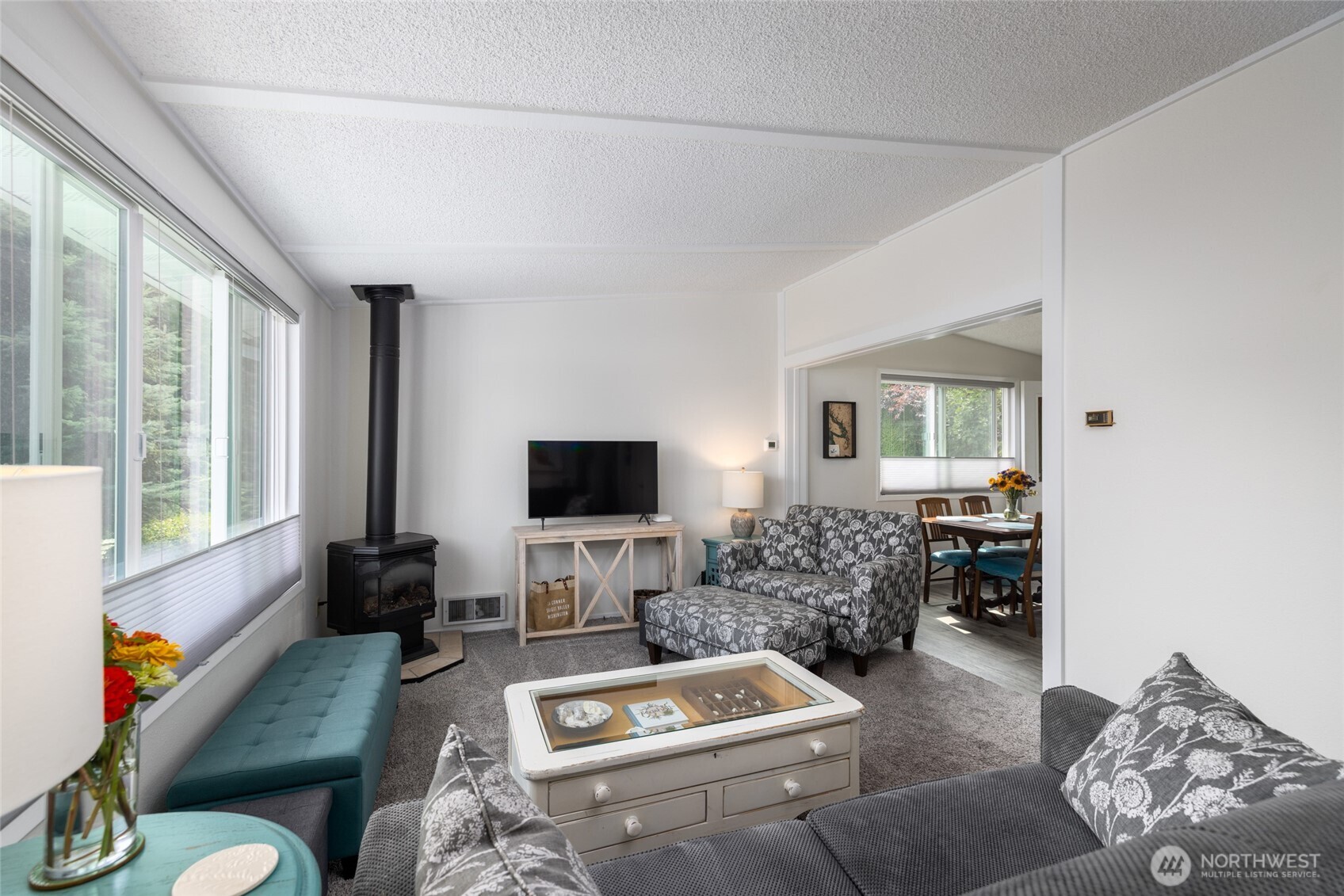 494 Colville Way La Conner, WA 98257 - Photo 5 of 39 a living room with furniture and a flat screen tv