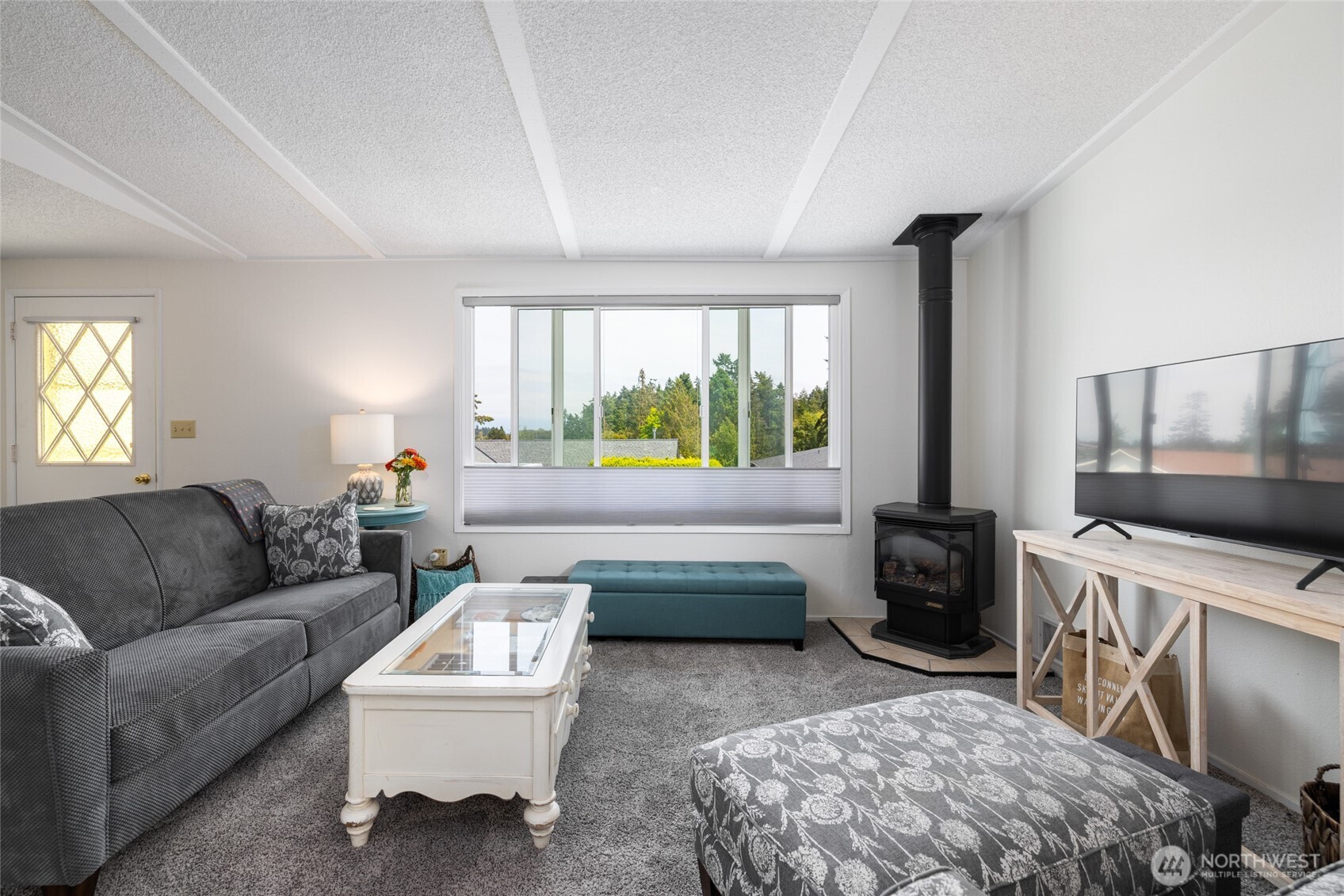 494 Colville Way La Conner, WA 98257 - Photo 8 of 39 a living room with furniture and a window