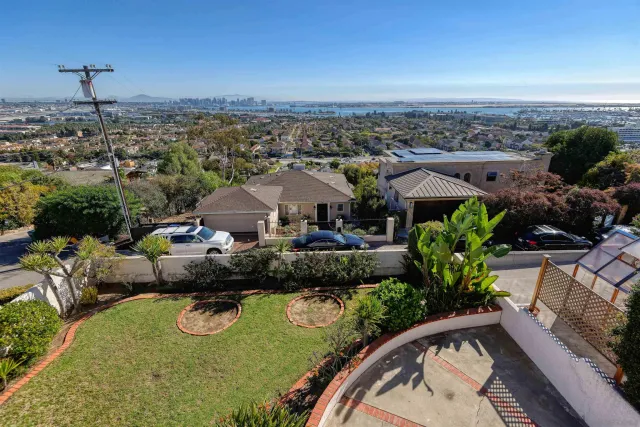 an aerial view of a house with yard swimming pool and outdoor seating
