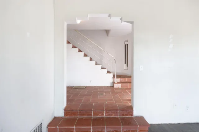 a view of a hallway with windows