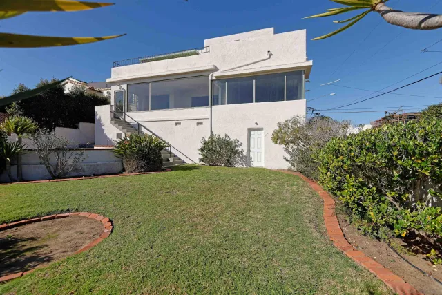 a view of a backyard of the house