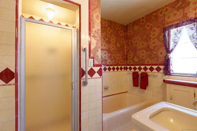 a bathroom with a sink and a shower curtain