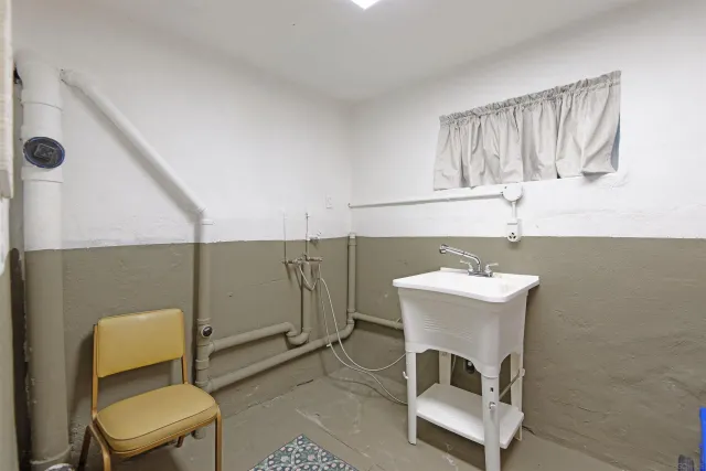 a bathroom with a sink toilet and mirror