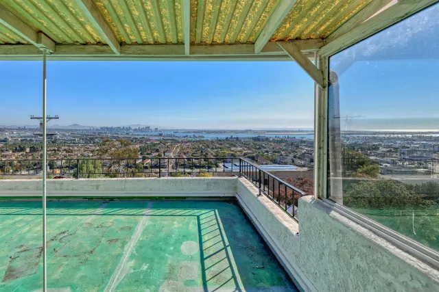 a view of balcony with a yard
