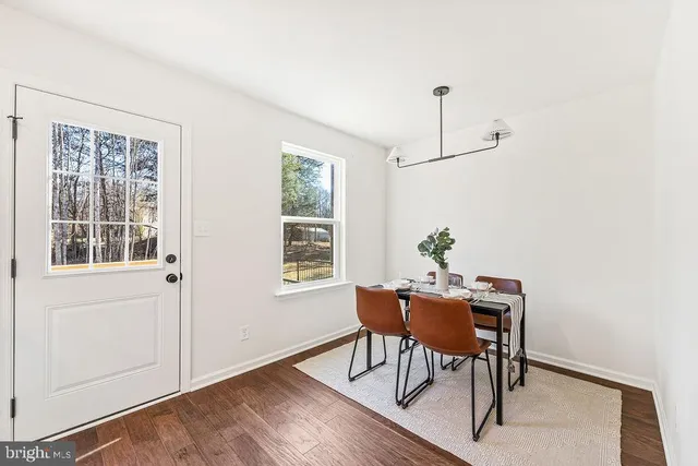 a workspace room with furniture window and wooden floor