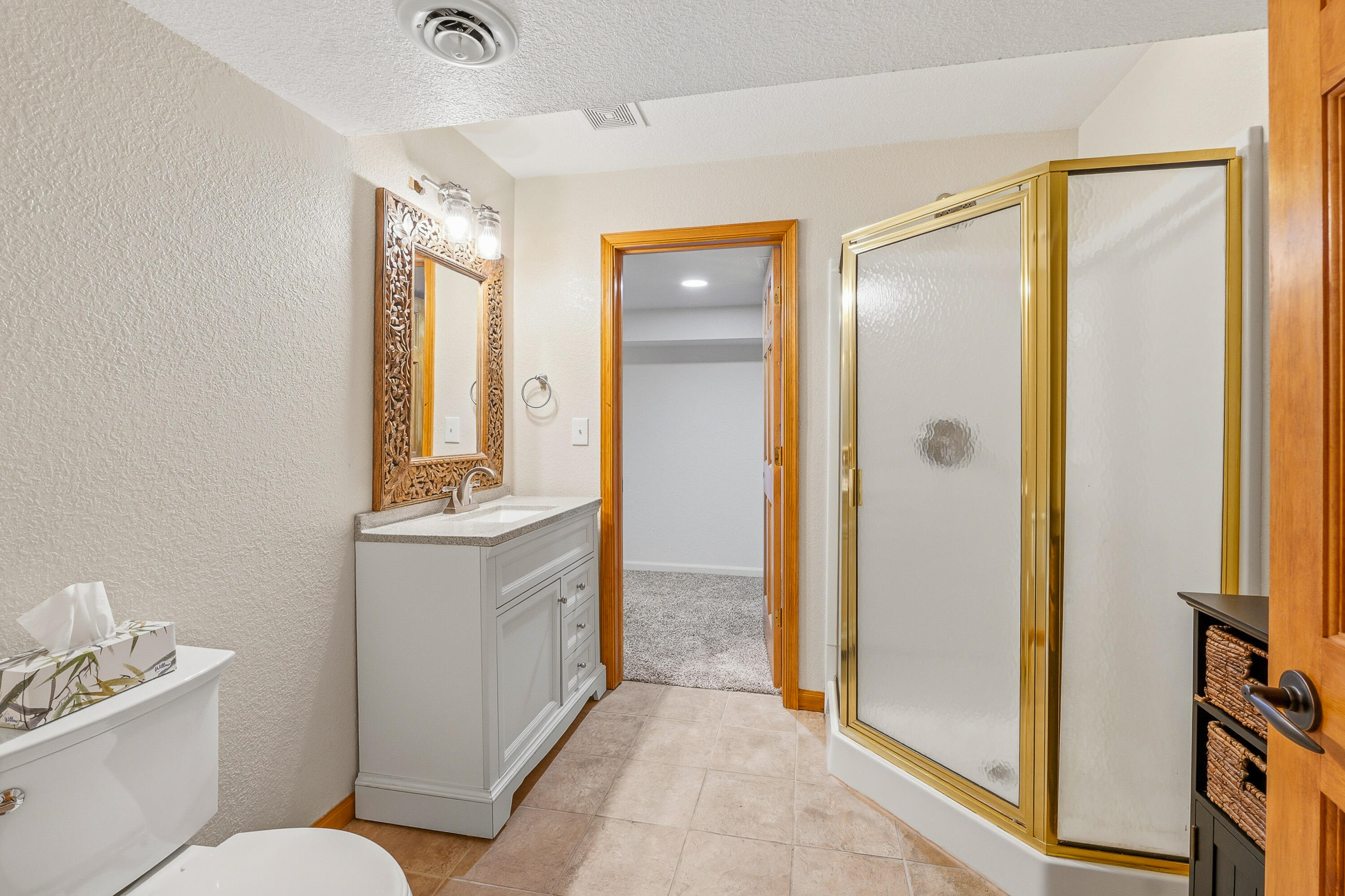 34899 Pabst Road Summit, WI 53066 - Photo 30 of 38 Lower-level full bath with convenient access from both the bonus room and hallway.