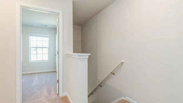 a view of a hallway with a white walls
