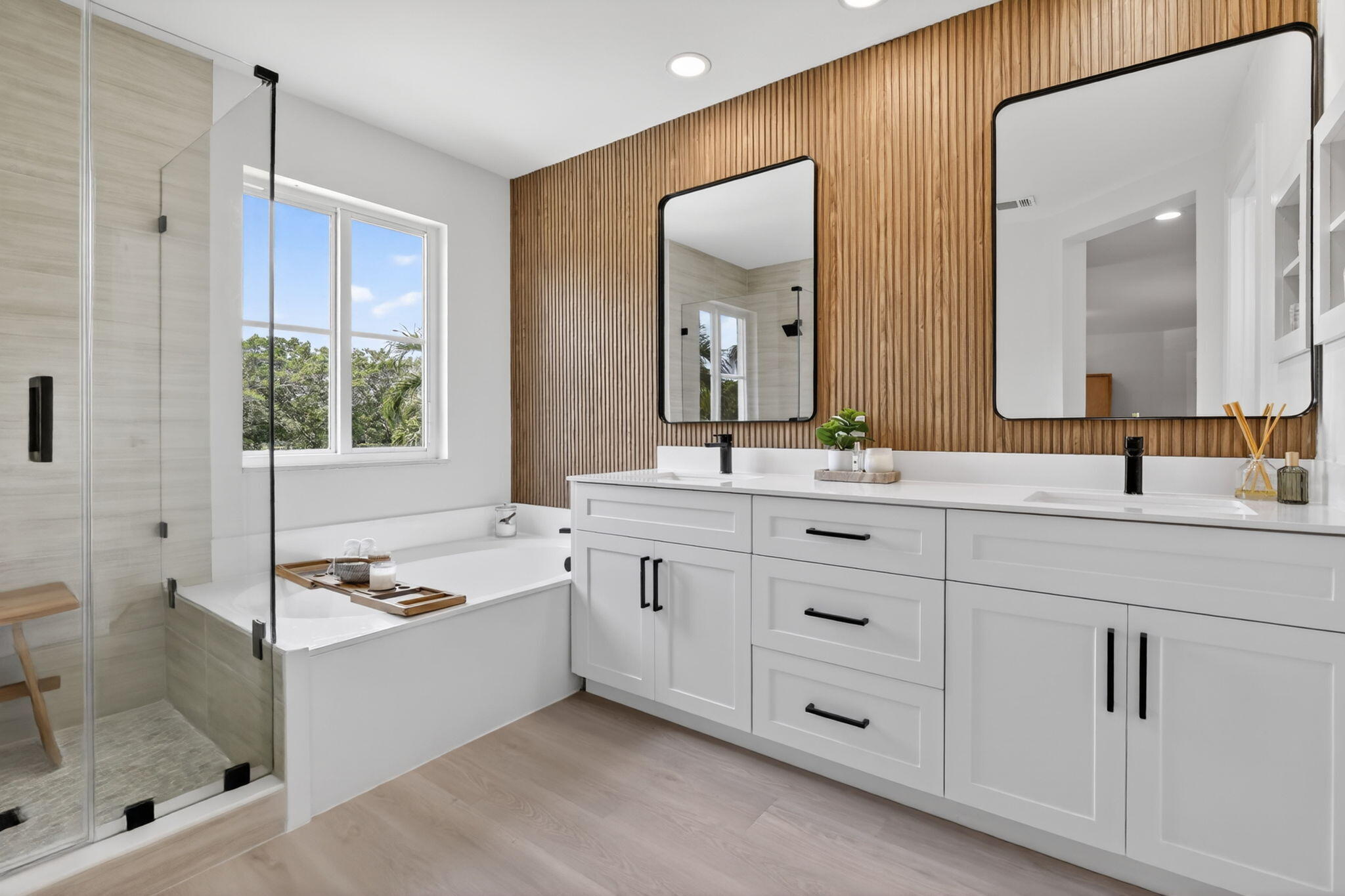 4299 Laurel Ridge Circle Weston, FL 33331 - Photo 6 of 103 a bathroom with a granite countertop sink mirror and a bathtub