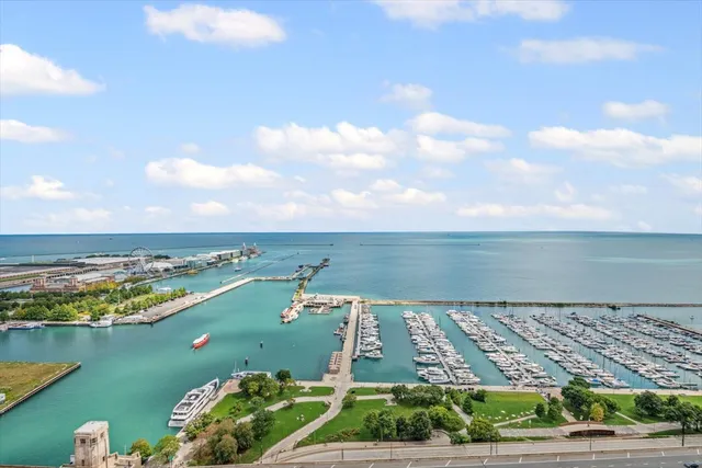 a room with lots of wooden furniture and lots of chairs