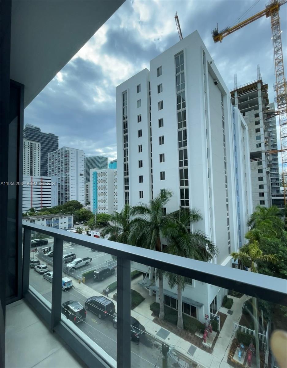 239 Southwest 9th Street, Unit 405 Miami, FL 33130 - Photo 10 of 17 a balcony view with a garden
