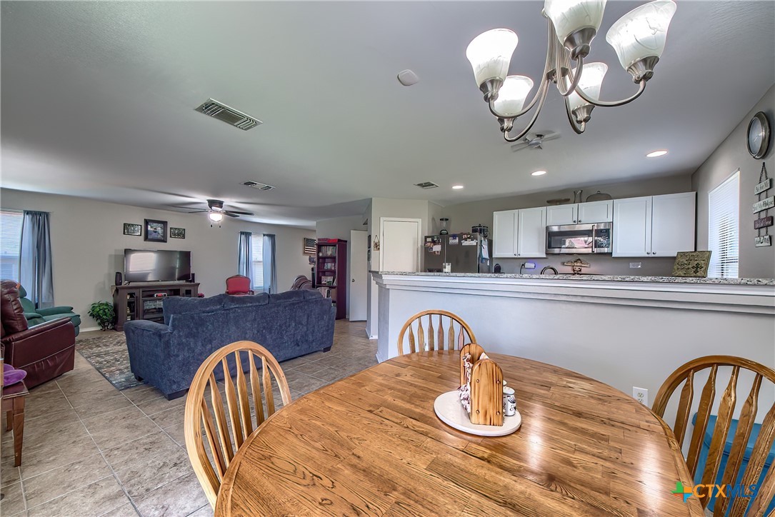 5709 Ping Way Schertz, TX 78108 - Photo 14 of 28 a living room with furniture kitchen view and living room