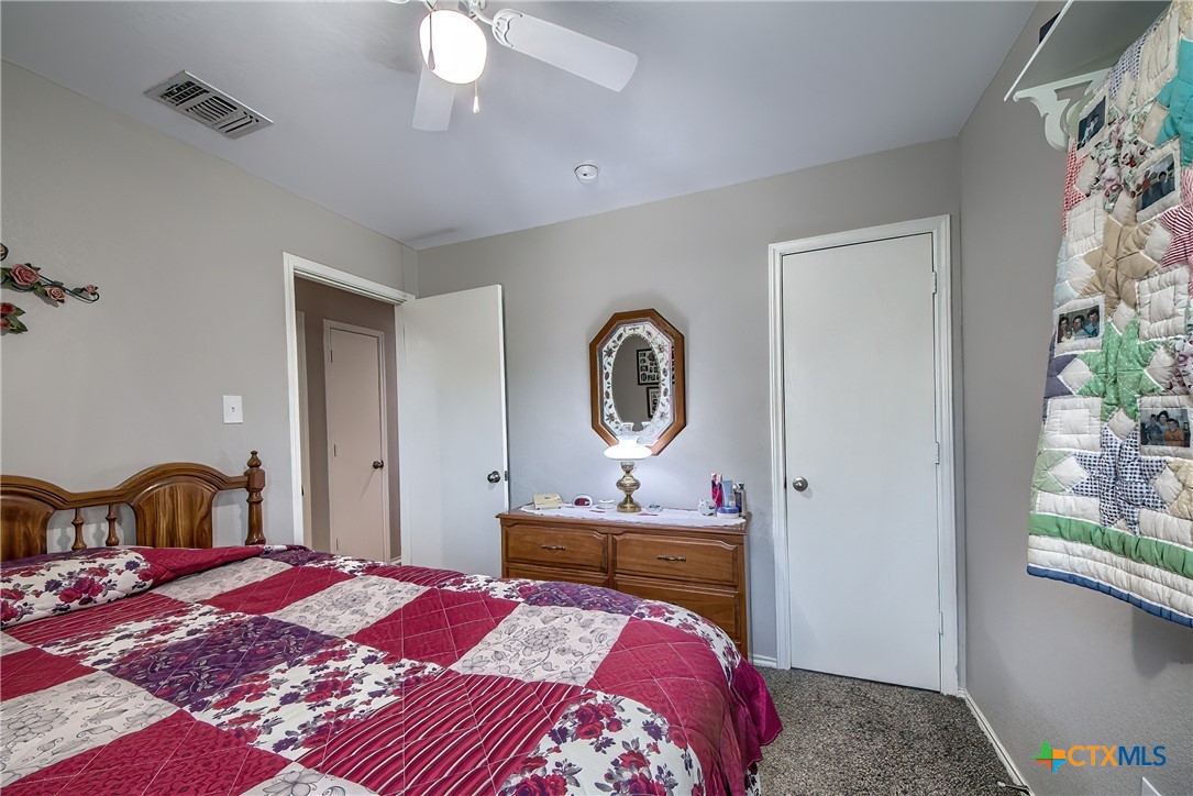 5709 Ping Way Schertz, TX 78108 - Photo 16 of 28 a bedroom with a bed and a window