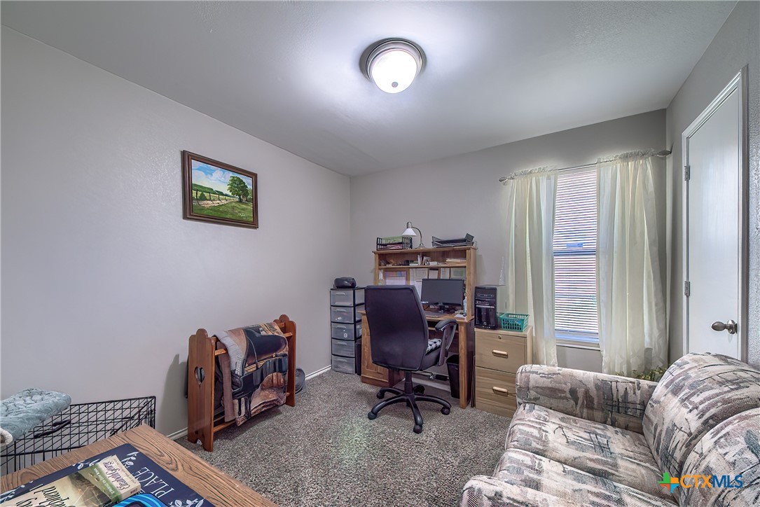 5709 Ping Way Schertz, TX 78108 - Photo 20 of 28 a view of a livingroom with workspace and a window