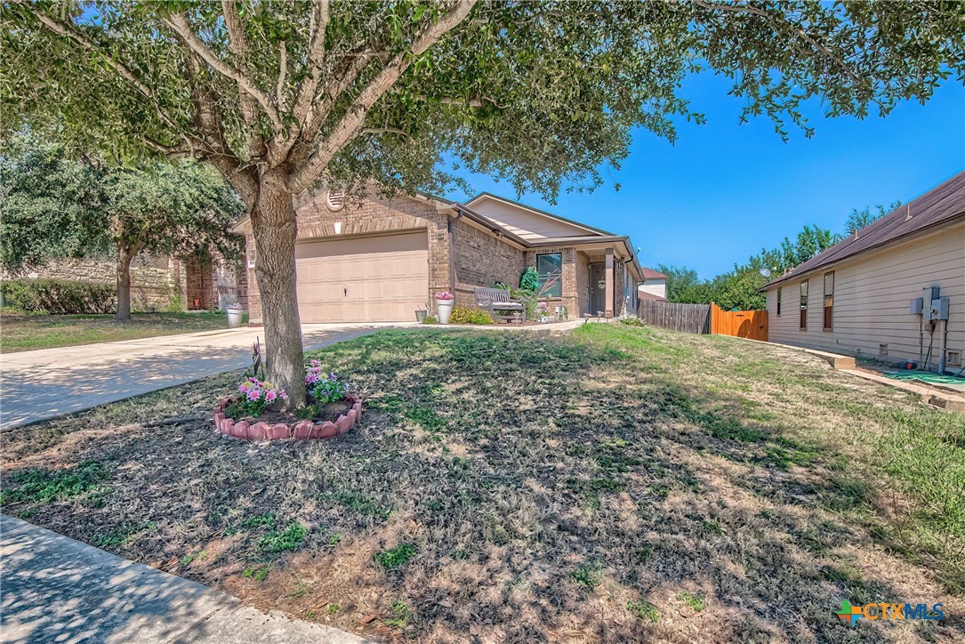 5709 Ping Way Schertz, TX 78108 - Photo 2 of 28 a front view of a house with garden