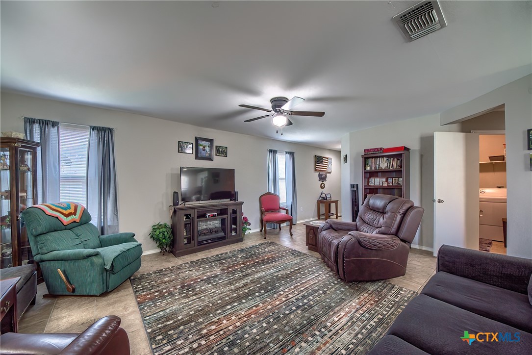 5709 Ping Way Schertz, TX 78108 - Photo 6 of 28 a living room with furniture and a flat screen tv