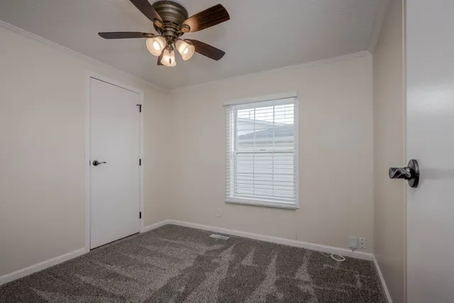 a view of an empty room with a window