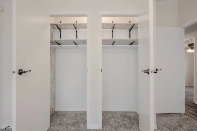 a bathroom with a granite countertop shower