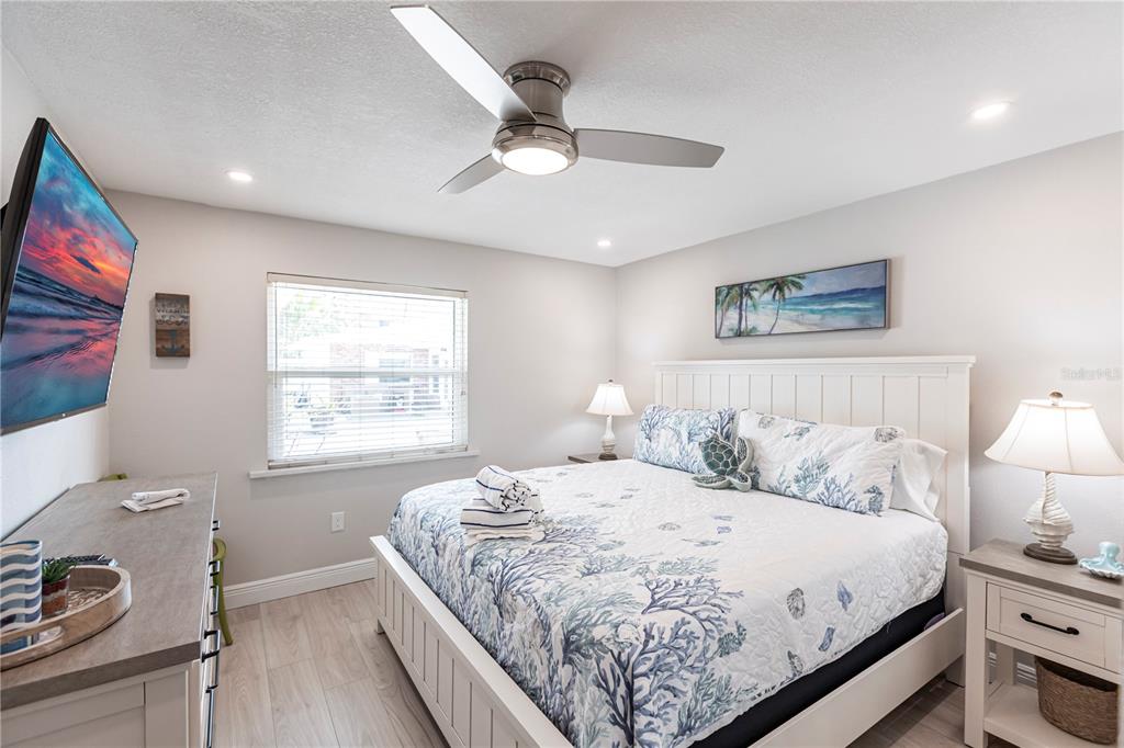 6020 Midnight Pass Road, Unit 56 Sarasota, FL 34242 - Photo 19 of 29 a bedroom with a bed and a window