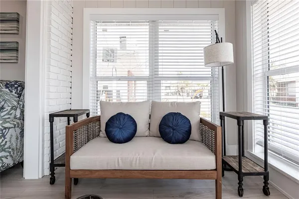 a bedroom with furniture and a window