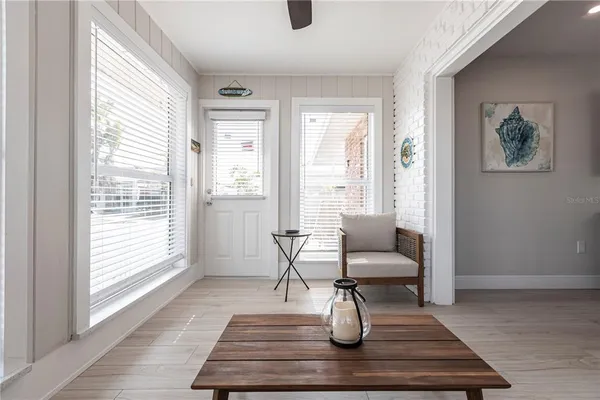 a living room with couch and a window