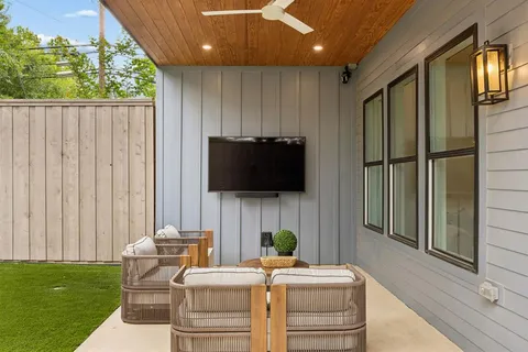 a swimming pool with outdoor seating and yard