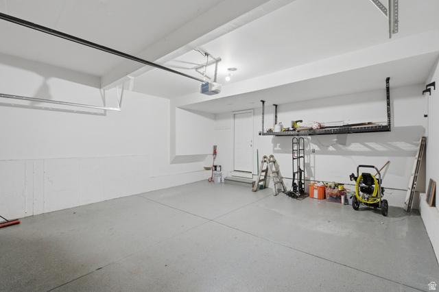 2223 North Pointe Meadow Loop Lehi, UT 84048 - Photo 46 of 56 Spacious garage featuring white walls and a light gray epoxy floor
