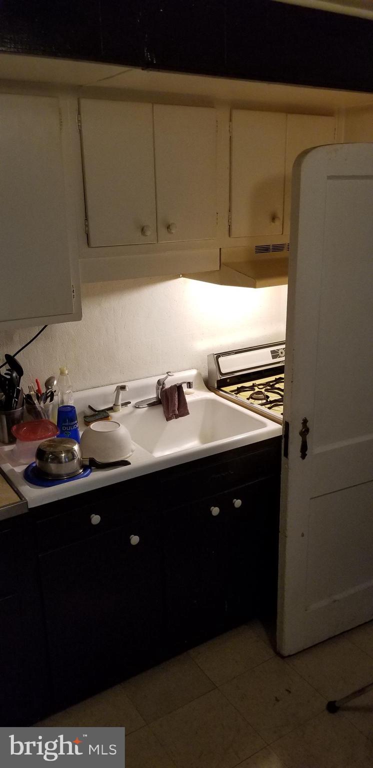 307 Hampden Road Upper Darby, PA 19082 - Photo 6 of 16 a kitchen with a sink and cabinets