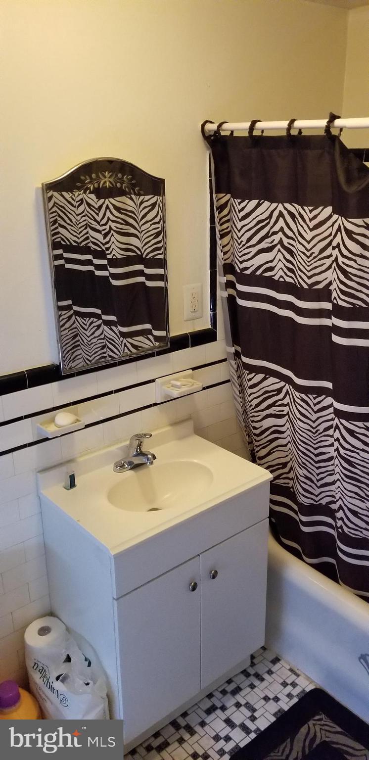 307 Hampden Road Upper Darby, PA 19082 - Photo 9 of 16 a bathroom with a sink and a mirror