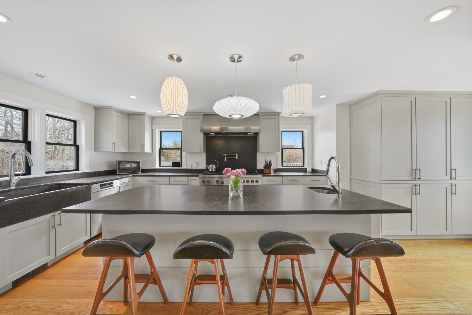 247 Polpis Road Nantucket, MA 02554 - Photo 13 of 52 a view of a center island and dining table