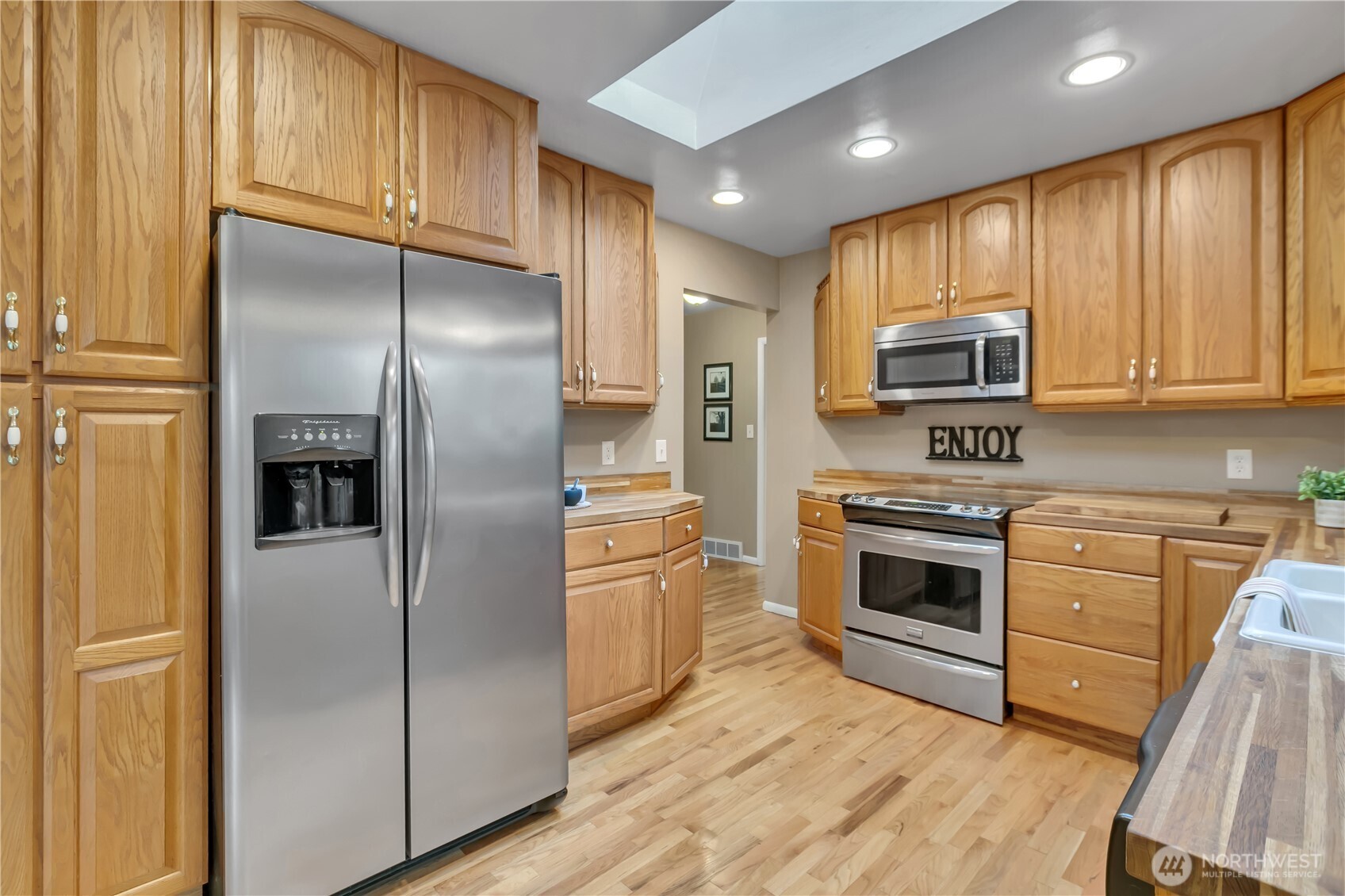 13733 Southeast 272nd Street Kent, WA 98042 - Photo 12 of 40 a kitchen with stainless steel appliances granite countertop a refrigerator stove and sink