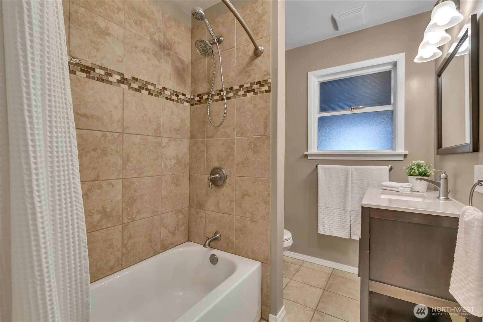 13733 Southeast 272nd Street Kent, WA 98042 - Photo 17 of 40 a bathroom with a sink a toilet and shower