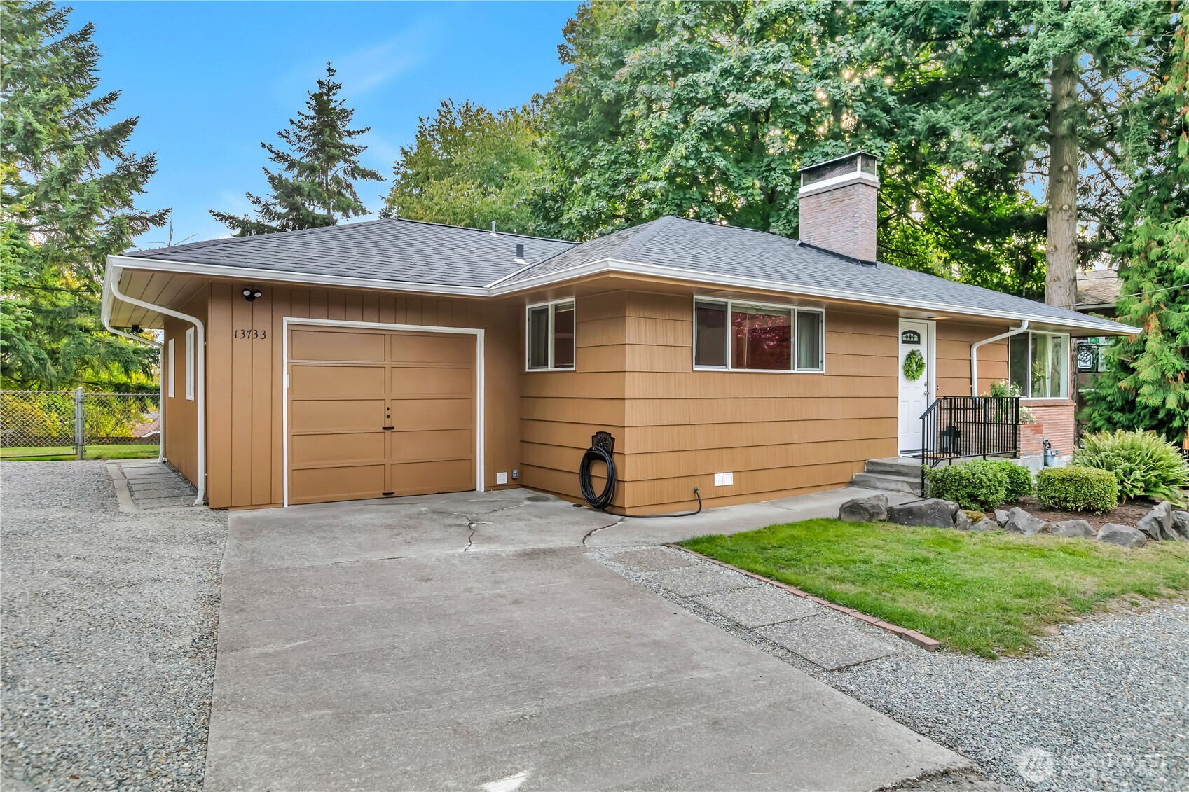 13733 Southeast 272nd Street Kent, WA 98042 - Photo 3 of 40 a front view of a house with yard and garage