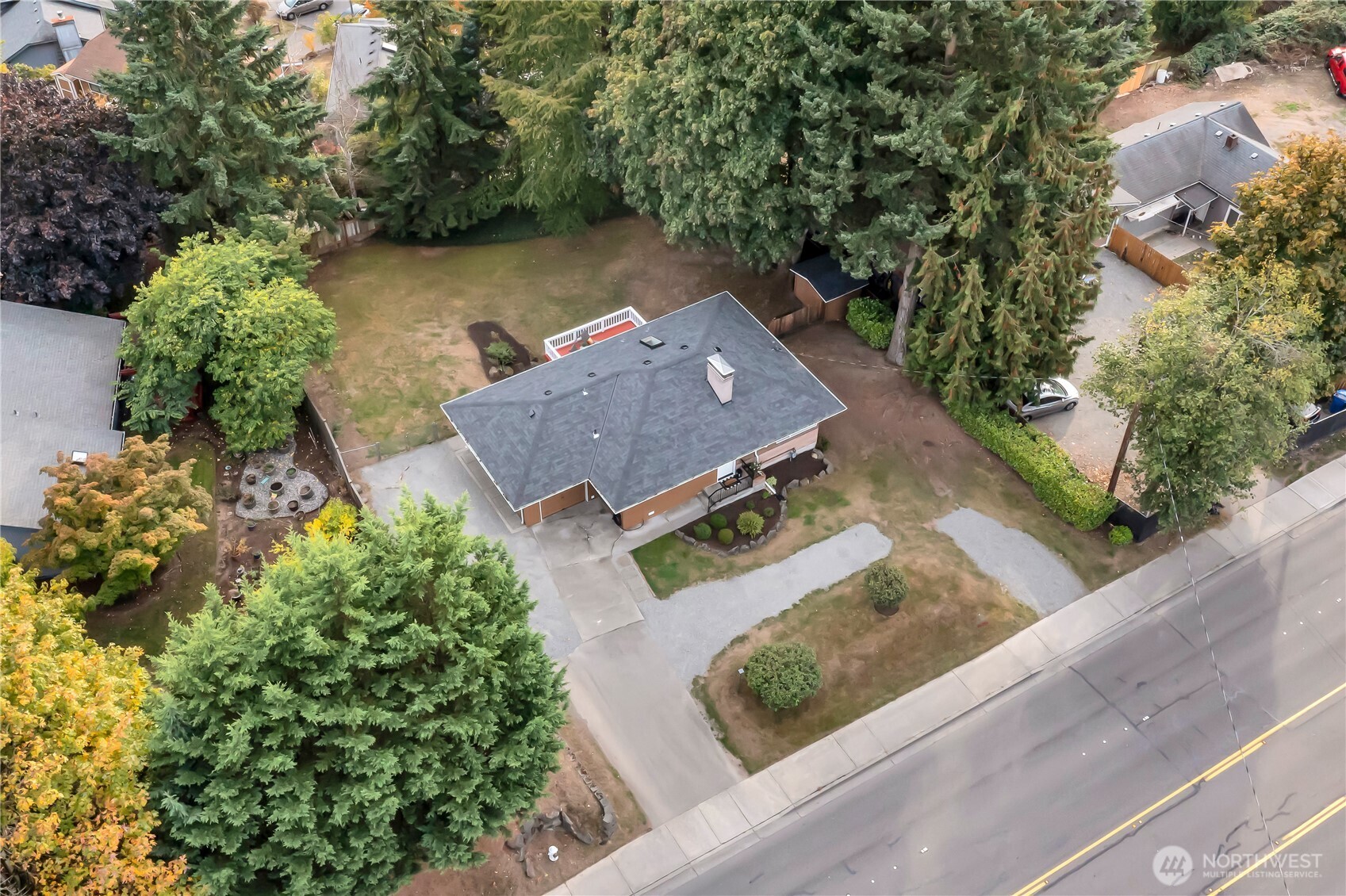 13733 Southeast 272nd Street Kent, WA 98042 - Photo 36 of 40 an aerial view of a house with a garden and lake view